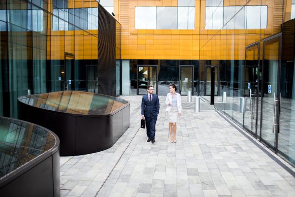 talking-coworkers-walking-on-building-terrace-UD2KVMA-1.jpg